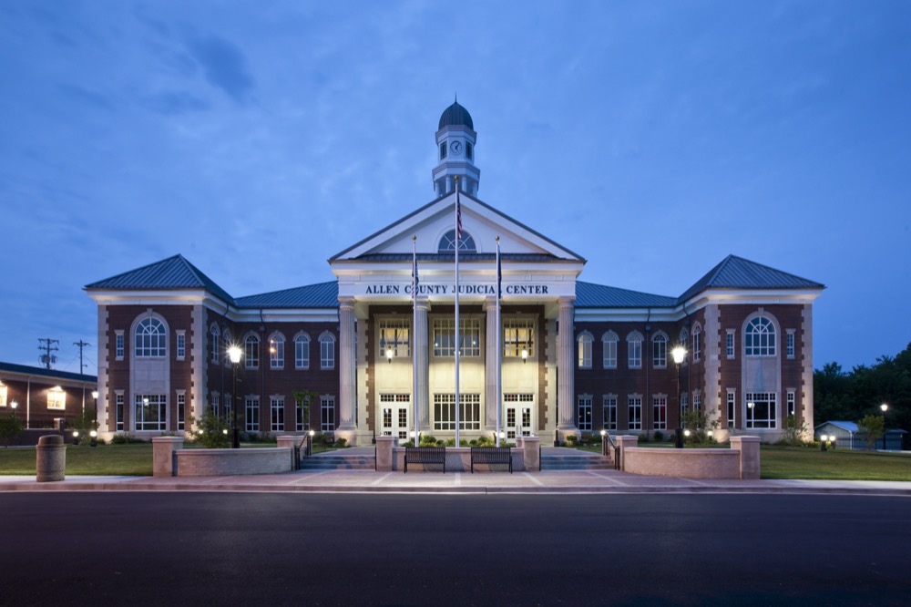 Allen County Judicial Center features an octagonal cupola incorporating four illuminated clocks and an open belfry featuring the original bell from the old courthouse.